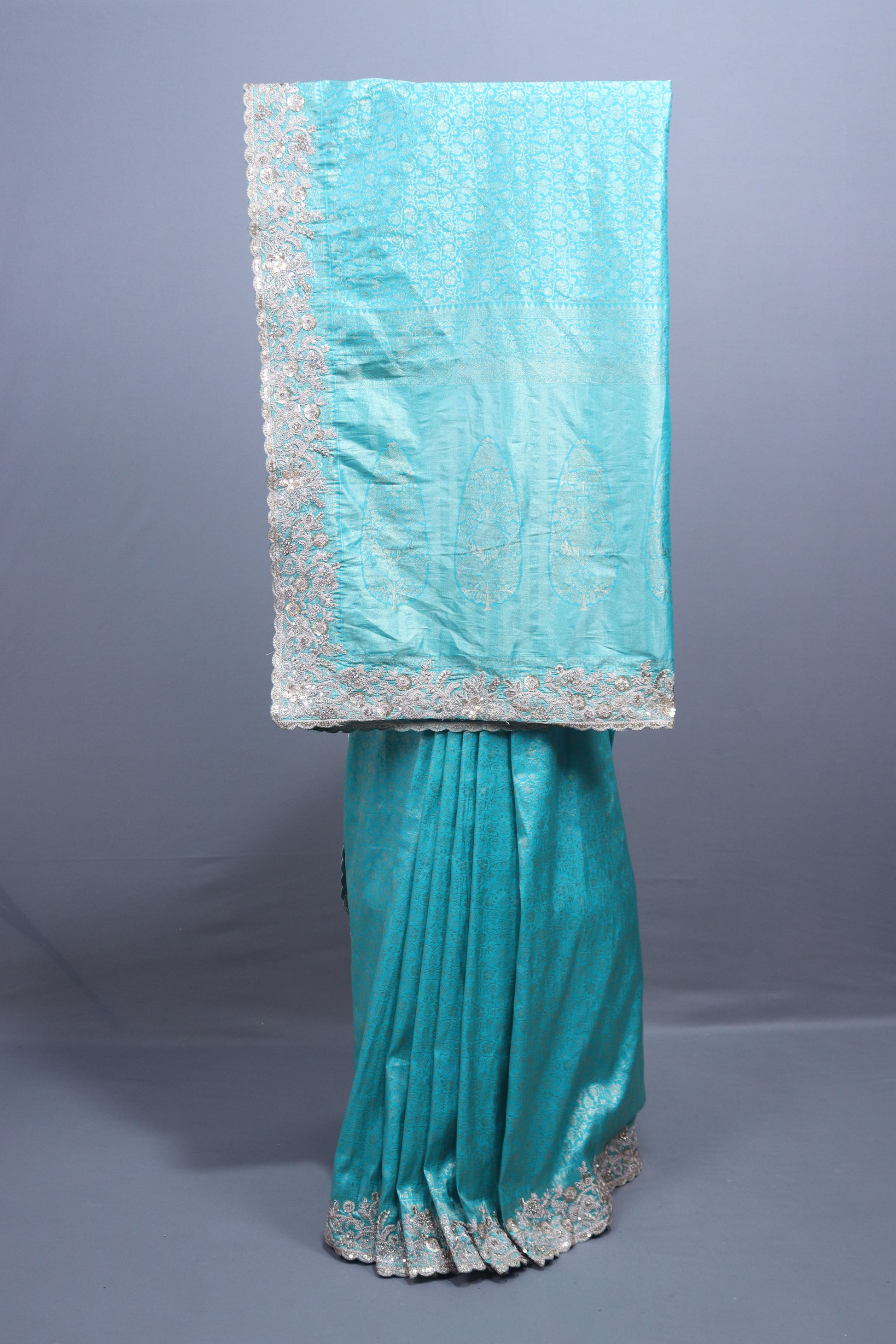 Turquoise Blue Silk Saree with Silver Zari Embroidered Lace Border 