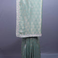 Pastel Green Silk Saree Geometric Weave Floral Zari Embroidered Border 