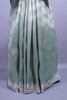 Pastel Green Silk Saree Geometric Weave Floral Zari Embroidered Border