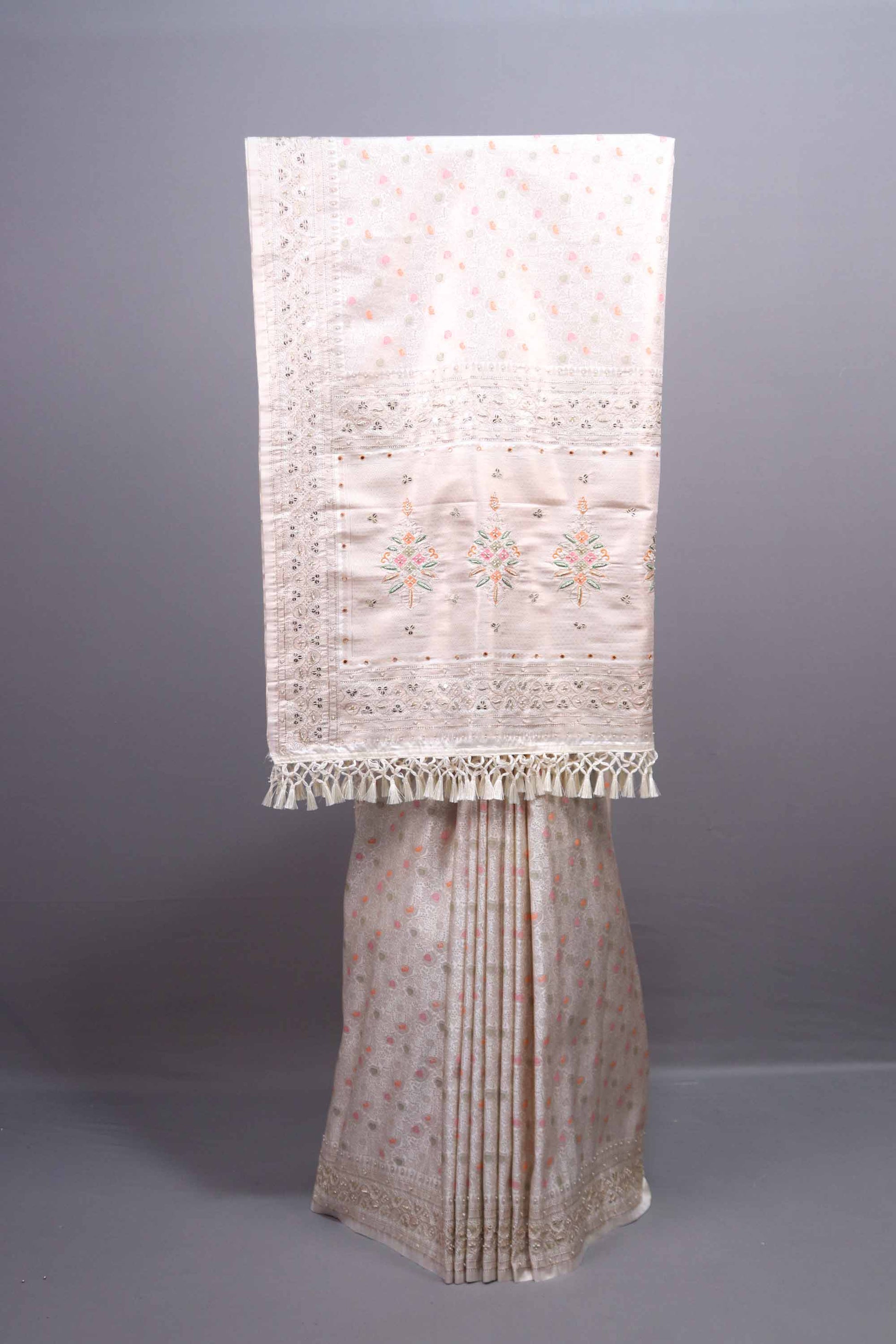 Off White Embroidered Silk Saree with Floral Pallu Tassel Border 