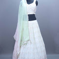 Elegant White Embroidered Lehenga Choli with Pastel Dupatta