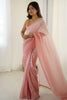 Elegant Peach Organza Saree with Minimal Texture Tassel Border