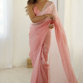 Elegant Peach Organza Saree with Minimal Texture Tassel Border