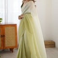 Pistachio Green Organza Saree with Soft Shaded Finish Tassel Border