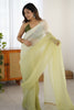 Pistachio Green Organza Saree with Soft Shaded Finish Tassel Border