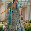Delicate Teal Green Butterfly Net Heavy Embroidered Lehenga Choli with Dupatta for Women