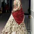 Festive Off White Foil Printed Tassar Silk Lehenga Choli with Maroon Dupatta for Women