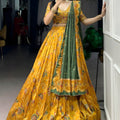 Admiring Mustard Yellow Foil Printed Tassar Silk Lehenga Choli with Green Dupatta for Women