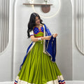 Graceful Lime Green Cotton Navratri Lehenga Choli with Royal Blue Lace Work Dupatta