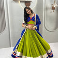 Graceful Lime Green Cotton Navratri Lehenga Choli with Royal Blue Lace Work Dupatta