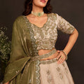 Magnificent Beige Fendy Silk Designer Lehenga Choli with Heavy Gold Embroidery and Dupatta