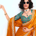 Orange Georgette Saree with Gold Lace Border and Printed Blouse