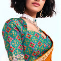 Orange Georgette Saree with Gold Lace Border and Printed Blouse