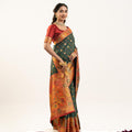 Designer Bottle Green Patola Silk Saree with Rich Red Contrast Blouse