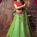 Vivid Parrot Green and Rani Pink Brocade Silk Designer Lehenga Choli with Gold Zari Weaving Work