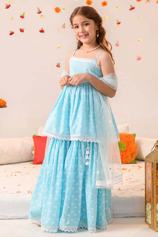 Young girl in graceful sky blue printed palazzo suit with dupatta