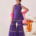 Young girl wearing trendy purple printed sharara set with pink dupatta