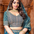 Banarasi Tissue Pleated Teal Blue Lehenga with Floral Woven Motifs - Mangaldeep NX