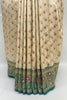 Elegant Cream Banarasi Silk Saree with Green & Red Floral Zari Weaving - Mangaldeep NX