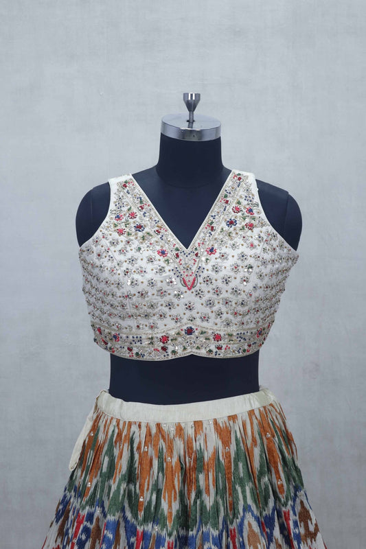Ivory Mirror Work Embroidered Blouse with Multicolor Ikat Print Lehenga and Silk Dupatta - Mangaldeep NX