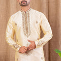 Men's Cream Art Silk Kurta Pyjama Set with All - Over Embroidery and Contrast Red Bottoms - Mangaldeep NX