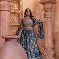 Banarasi Tissue Pleated Teal Blue Lehenga with Floral Woven Motifs