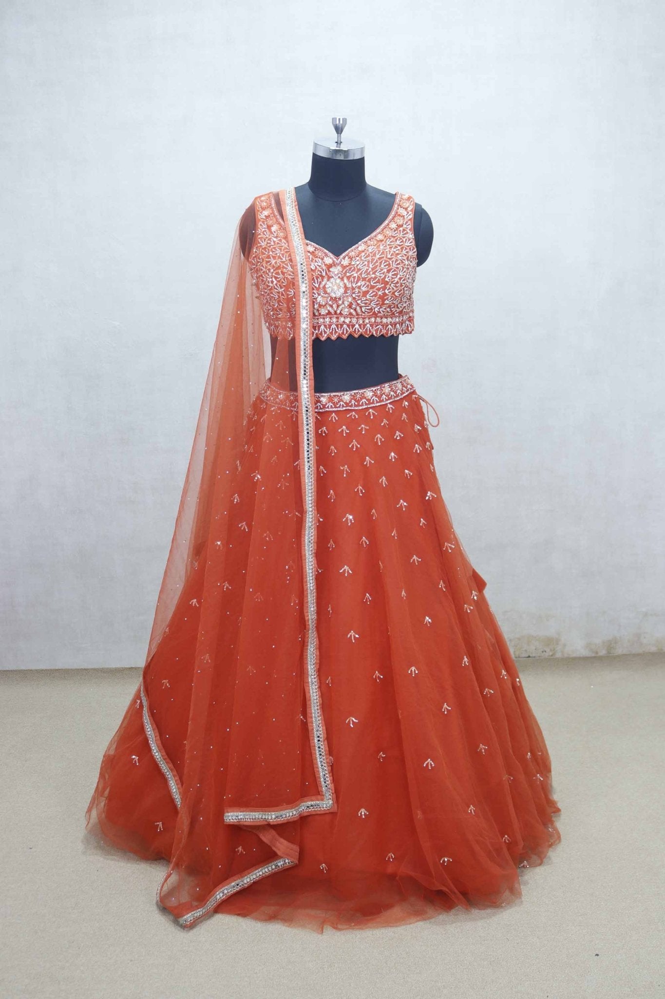 Rust Orange Net Embroidered Lehenga Choli with Sequin Work and Sheer Dupatta - Mangaldeep NX