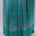 Turquoise Blue Banarasi Silk Saree with Golden Zari Floral Weaving & Tassel Pallu – Traditional Wedding & Festive Wear - Mangaldeep NX