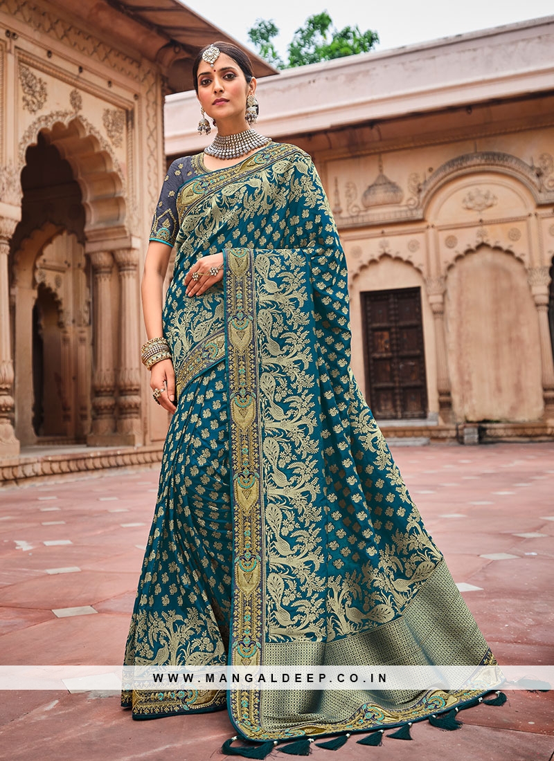 https://www.mangaldeep.co.in/image/cache/data/teal-blue-color-dolla-silk-saree-for-women-35599-800x1100.jpg
